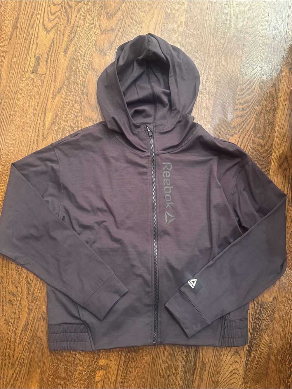 NWOT Reebok black zip up with hood